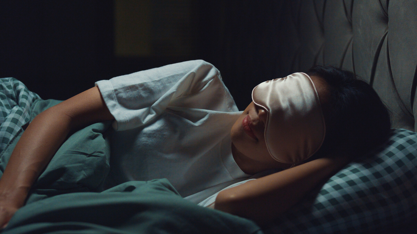 Woman sleeping with eye mask. 